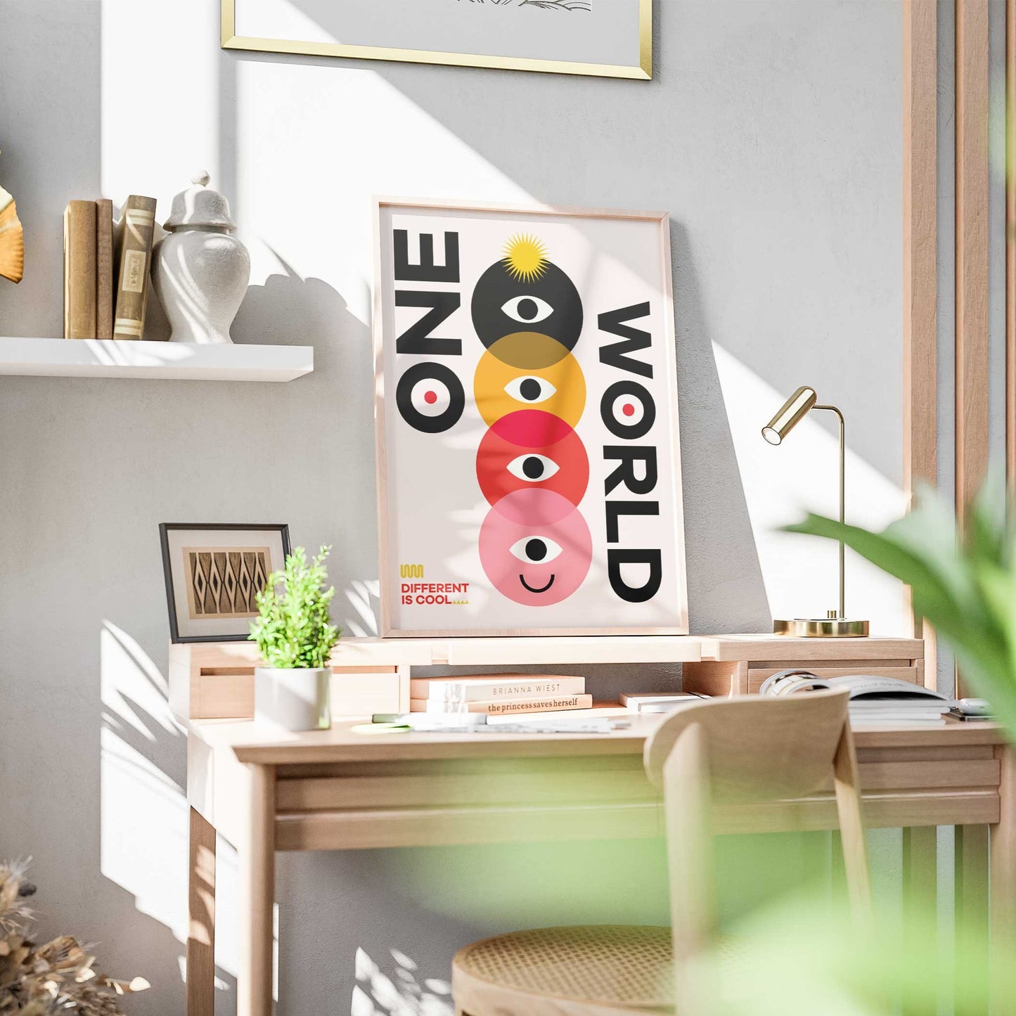Poster con il testo 'One World' accompagnato da un design geometrico colorato con cerchi sovrapposti in nero, giallo, rosso e rosa, ciascuno contenente un occhio stilizzato e un volto sorridente nell'ultimo cerchio. In basso a sinistra la scritta 'Different is Cool'. Design moderno e simbolico su sfondo chiaro.